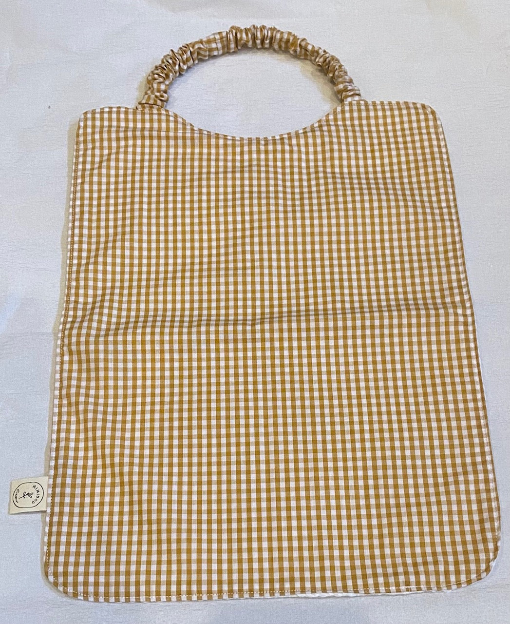 Bavoir cantine petits carreaux beige