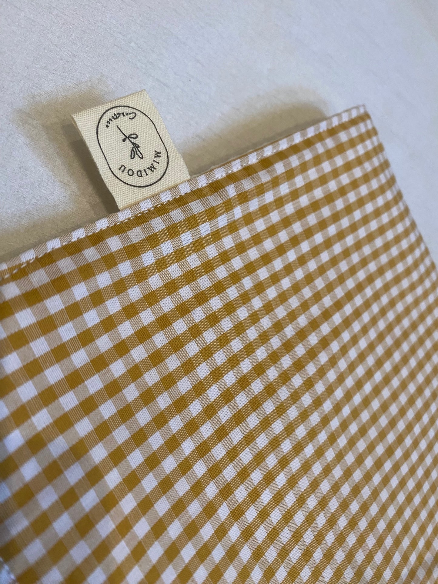 Bavoir cantine petits carreaux beige