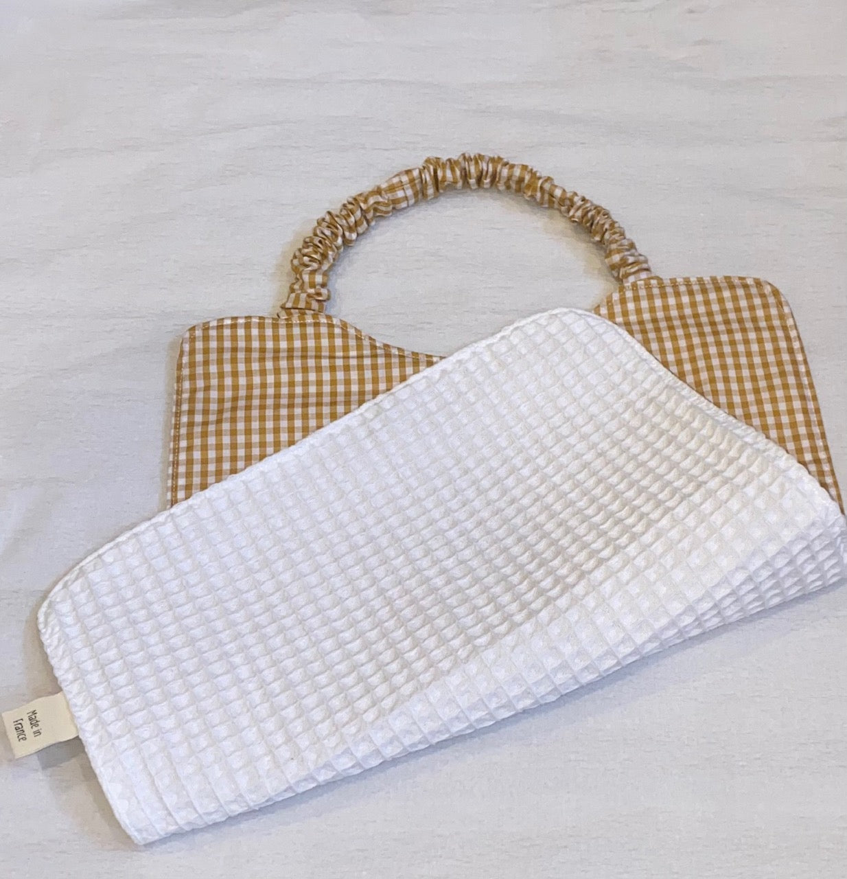 Bavoir cantine petits carreaux beige